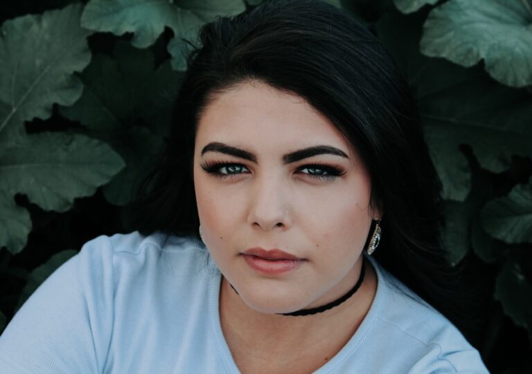 Woman with dark hair looking at the camera.